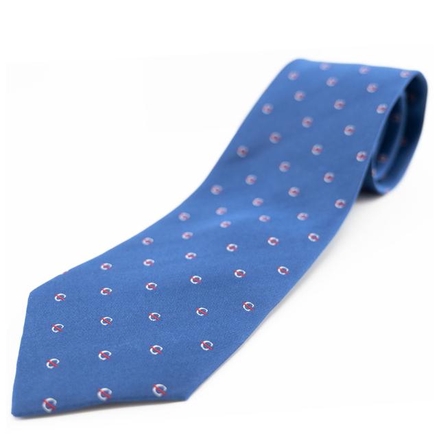 Blue silk tie with the white strikethrough 'C' pattern.